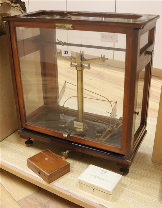 A mahogany cased set of chemists scales 51 x 46cm